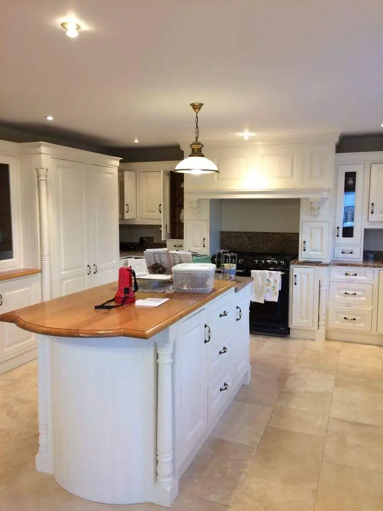 Kitchen cabinet repainting project showing professional spray finish by MS Partners
